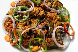 SNAILS GARNISHED WITH VEGETABLES – TOP VIEW CLOSE UP