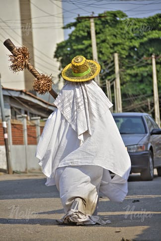 ANOTHER EYO MASQUERADE ON THE STREET OF LAGOS