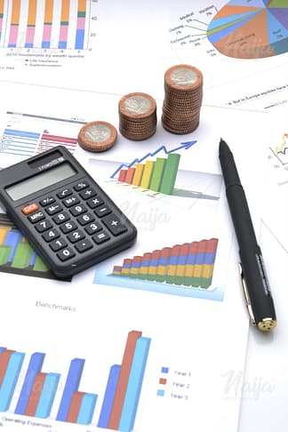 ACCOUNTING BUSINESS CALCULATOR AND COINS