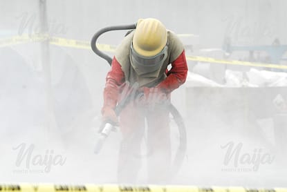 OIL AND GAS WORKER USING THE BLOWER