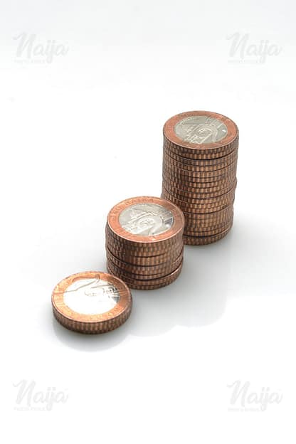 A STACK OF TWO NAIRA COINS