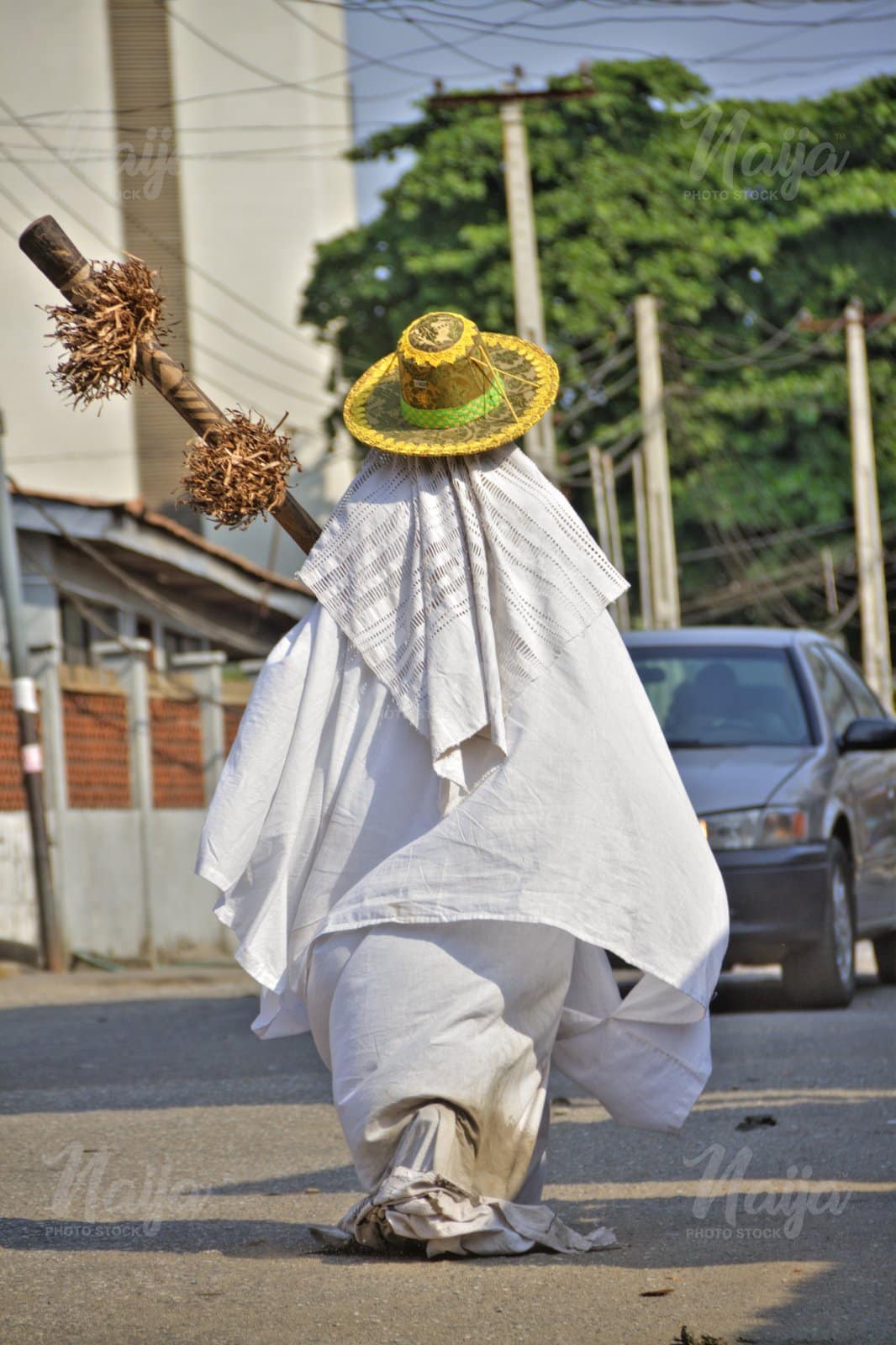 ANOTHER EYO MASQUERADE ON THE STREET OF LAGOS