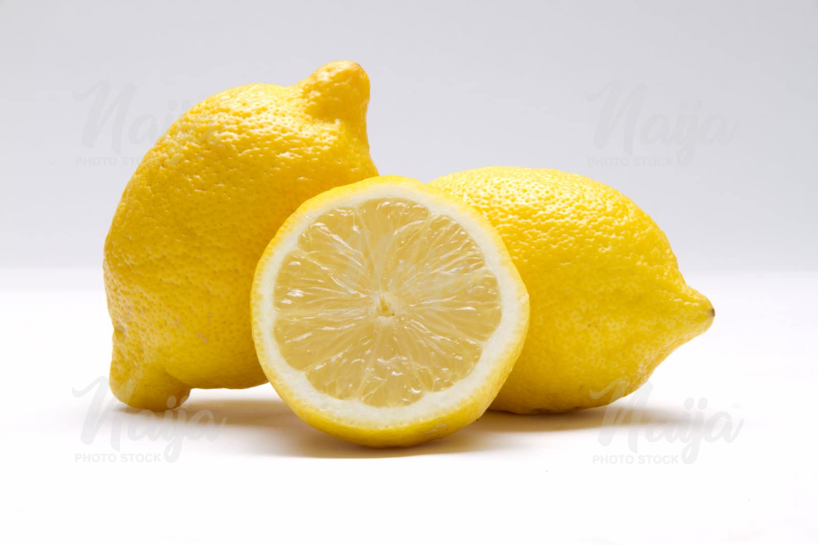 2 LEMONS AND ONE SLICED OPEN