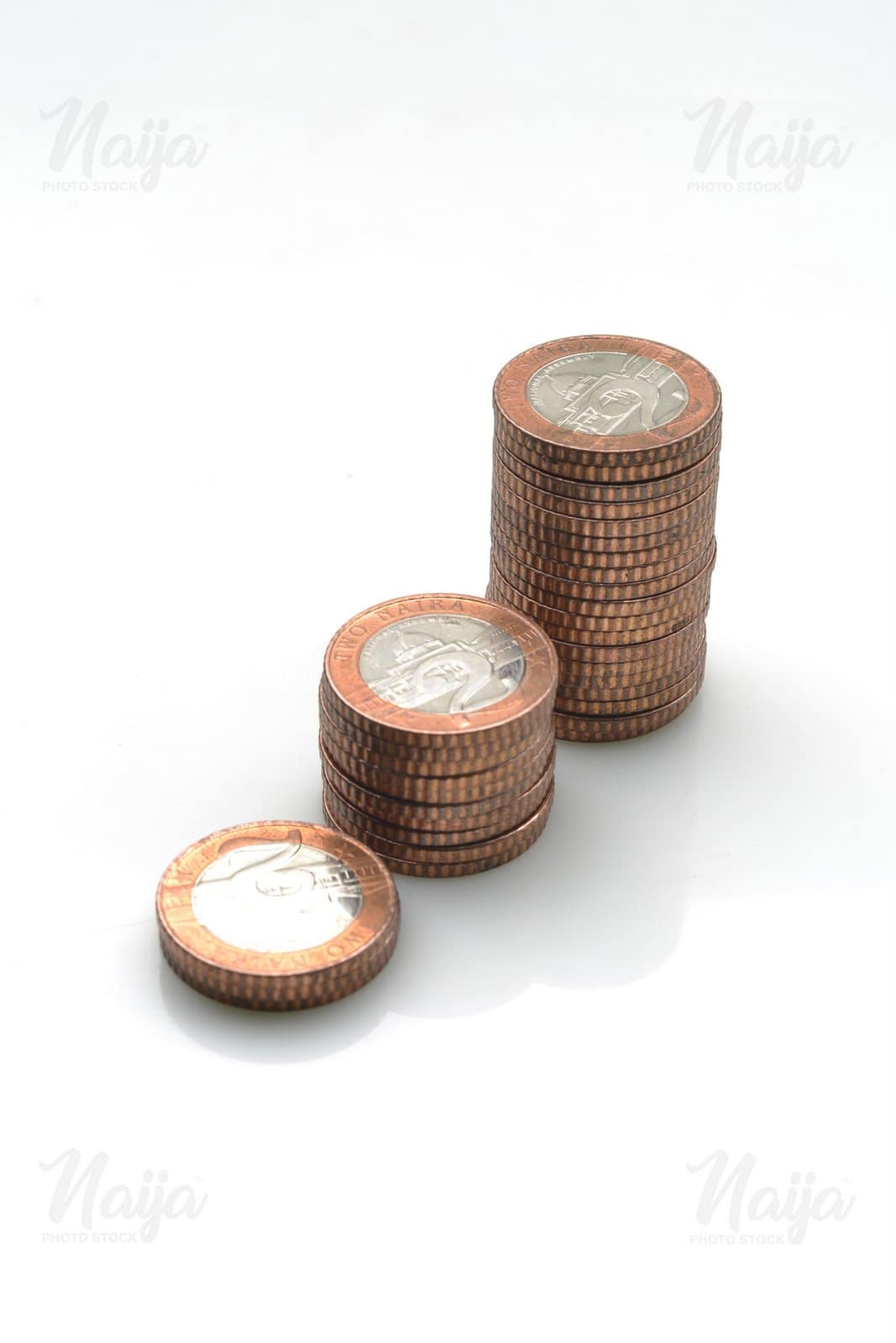 A STACK OF TWO NAIRA COINS
