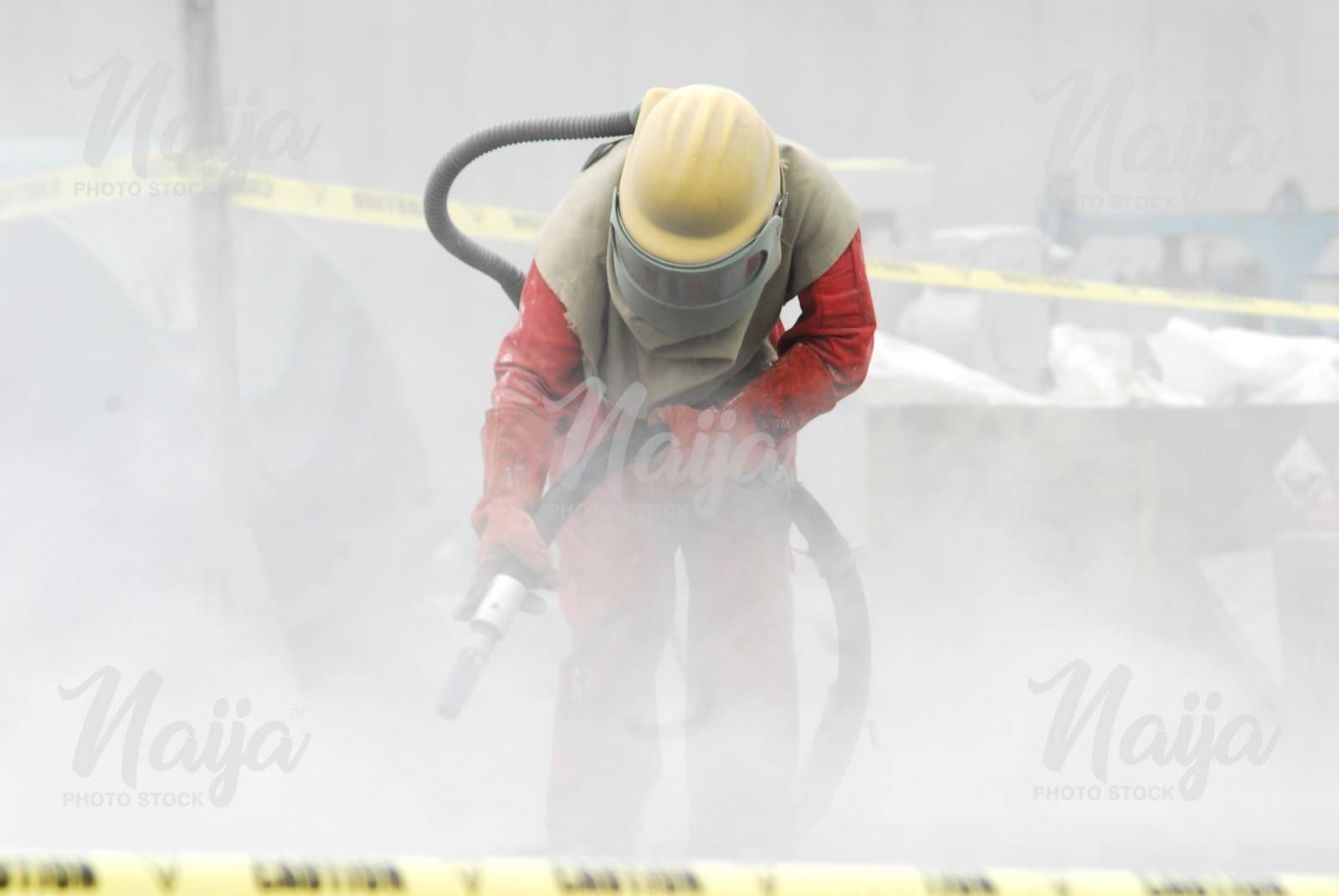 OIL AND GAS WORKER USING THE BLOWER